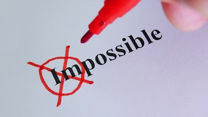 Remove word Impossible to read possible. Concept for self belief, positive attitude and motivation. Hand crosses out part of text on white paper. Motivation concept for business. New idea or plan