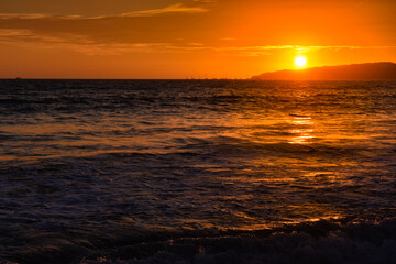 Fototapeta na wymiar orange sunset at the beach