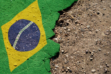 A crisis. Flag on the broken asphalt - Brazil