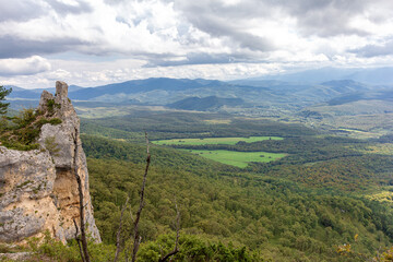 Naklejka premium Travel along the mountain range and plateau in a picturesque area, on a summer day, communication with nature, a tourist quest.