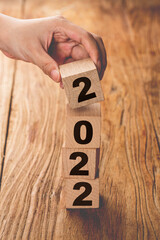 symbolize the change from 2021 to the new year 2022. 2022 happy new year concept. - obrazy, fototapety, plakaty