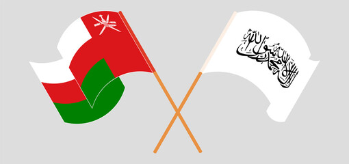 Crossed and waving flags of Oman and Taliban