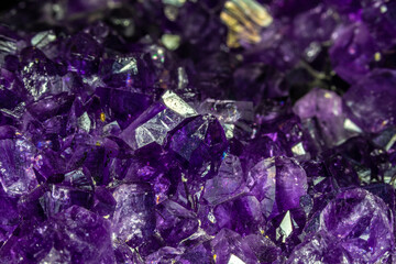Closeup of Uruguayan amethyst crystals, deep purple in color. 
