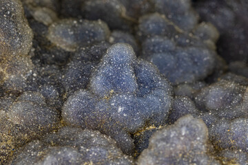 Closeup of druzy quartz in almost a boitroidal formations. Crystals are a pastel blue color. 
