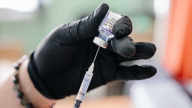 Kalush, Ukraine September 14, 2021: Pfizer antiviral vaccine in a vial against covid infection.