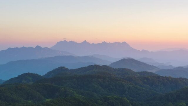 Time Lapse, a lovely winter scene. Beautiful landscape at Doi Kham Fah Viewpoint in Padaeng National Park, Chiang Mai, with Chiang Dao Mountain in the background. One of Thailand's most spectacular.