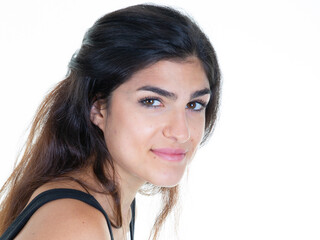 Pretty young woman with long brunette hair isolated against white studio background