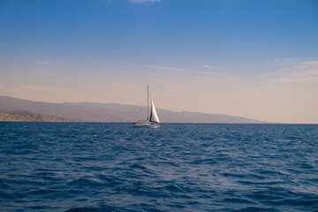 Fototapeta na wymiar Catamaran sail Yacht cruising on deep blue sea water