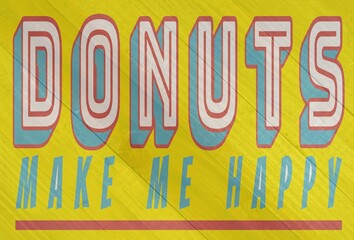 Donuts make me happy sign on wood grain texture