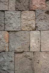 Massive masonry wall texture. Antique granite stone wall background.