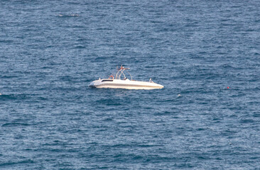 Fototapeta premium Boat on the waves of the sea.