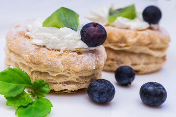 blueberry cream cakes on the white plate