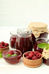 Fototapeta na wymiar Concept of tasty food with raspberry jam on wooden table
