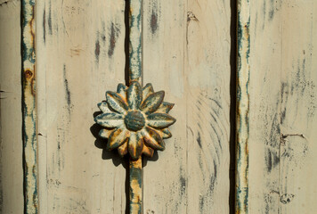 Rusty metal flower from wrought iron close