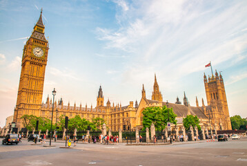 LONDON, UK - JULY 1ST, 2015: Tourists and locals walk in front of Westminster Palace.