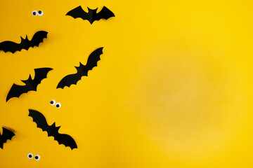 Yellow background with flying bats(halloween background)