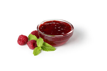 Glass bowl of raspberry jam isolated on white background