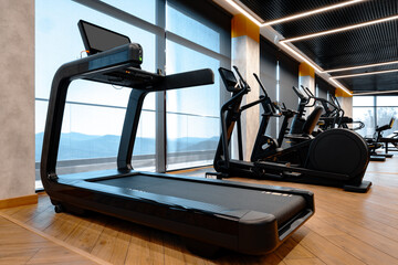 Studio shot of a professional treadmill in modern gym