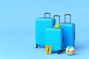 Suitcase with beach ball and flip flops on blue background.