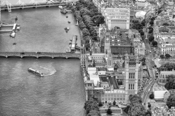 London aerial view from helicopter. Westminster Palace and Bridge downward viewpoint.