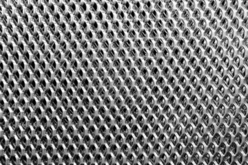 Texture of a multilayer metal lattice on a black background