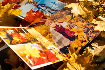 Autumn yellow leaves and family photobook. fall leaves arranged for a photo book background