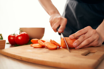 Obraz na płótnie Canvas cutting vegetables in the kitchen cooking ingredients vitamins