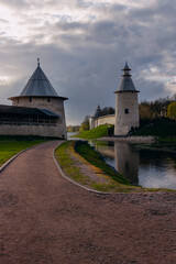 Naklejka premium Kremlin in Pskov, Russia. Ancient fortress. Stone towers on a summer day. Places for tourists and travel. An ancient Russian city. Postcard view