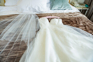 Wedding preparation, dress and bridal bouquet
