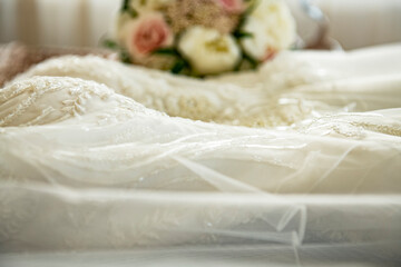 Wedding preparation, dress and bridal bouquet
