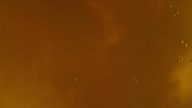 Full frame background texture of golden beer or ale