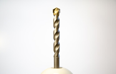 Drill bit for drilling concrete surfaces, isolated on a white background. Close-up helical surface...