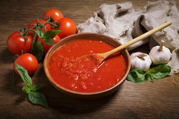 bowl of tomato sauce and fresh vegetables