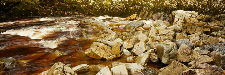 Rocky shore at Conwy Falls