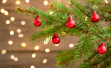 Christmas background with christmas tree, ornaments and defocused lights	
