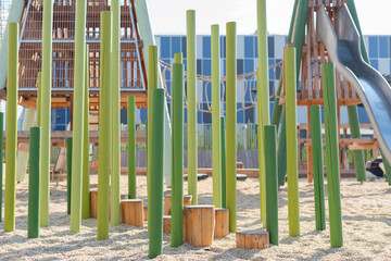 children's playground with a slide and a sandy surface without people. High quality photo