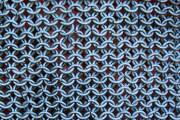 An element of chain mail made of steel plates and wire. Protection and defense of the knight