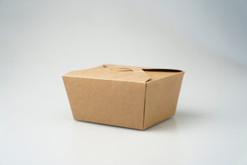 Take away box disposable food container craft paper mock up on grey background with copy space. Delivery food concept.