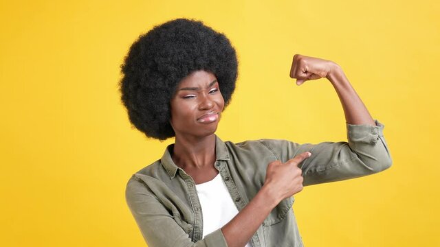 Powerful sporty military feminist lady flex strong bicep muscle kiss hand