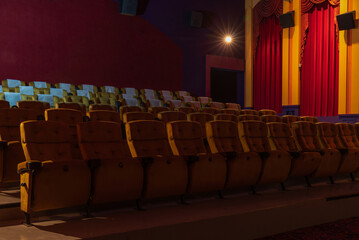 Inside empty cinema movie theater with yellow seats