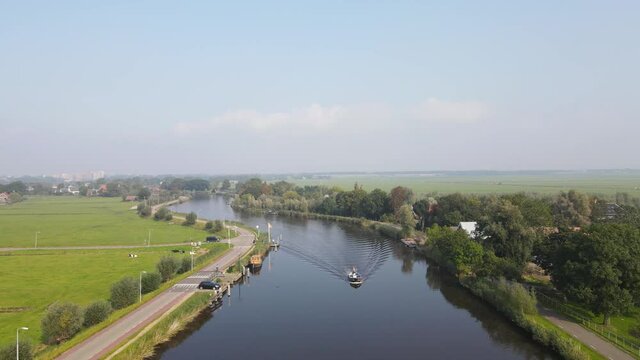 Aerial view of Amstelveen Oudekerk ad Amstel typical dutch landscape and historic village along the Amstel river in The Netherlands.