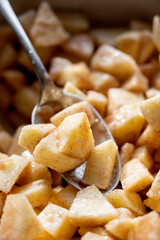 Cutted and peeled apples, close up. Cooking an apple pie or tart. Step by step recipe.
