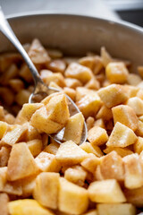 Cutted and peeled apples, close up. Cooking an apple pie or tart. Step by step recipe.