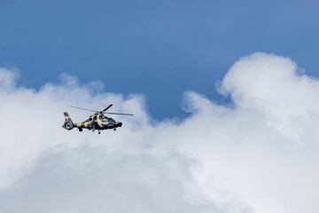 Fototapeta na wymiar HONG KONG, CHINA - August 07, 2020: People's Liberation Army helicopters patrol over the sky of Hong Kong