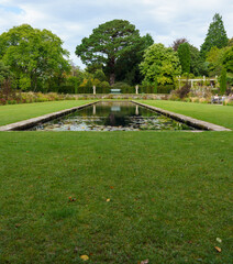 beautiful Pin Mill pond in the grade I listed gardens at Bodnant Gardens, Colwyn Bay, Wales UK