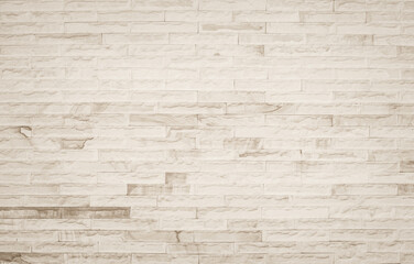 Cream and white brick wall texture background. Brickwork and stonework flooring interior rock old pattern