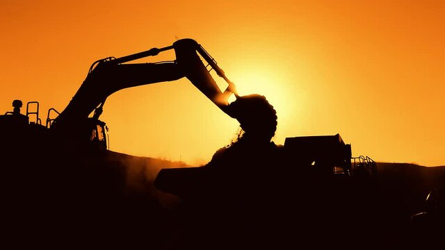 excavator at sunset
