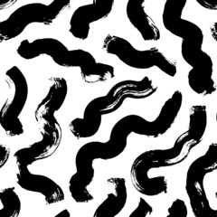 Hand drawn wavy and swirled brush strokes. Monochrome vector seamless pattern. Black paint doodle scribbles, curled lines, swooshes and flourishes. Abstract ink background, wallpaper design, textile