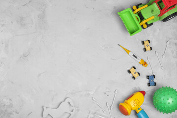 Set of different children's toys, nasal drops, cotton buds with stopper, thermometer and diapers on...