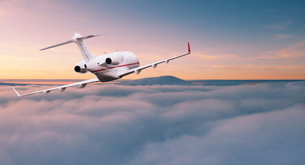 Private jetplane flying above dramatic clouds